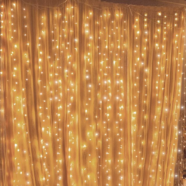  6. Twinkle Star 300 LED Window Curtain String Light 